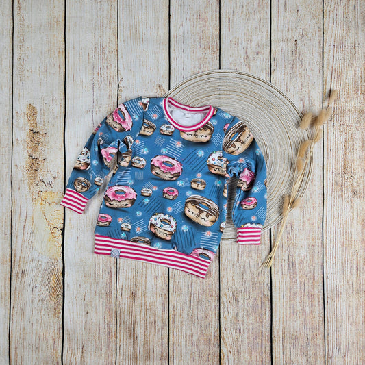 Sweatshirt mit bunten süßen Donuts